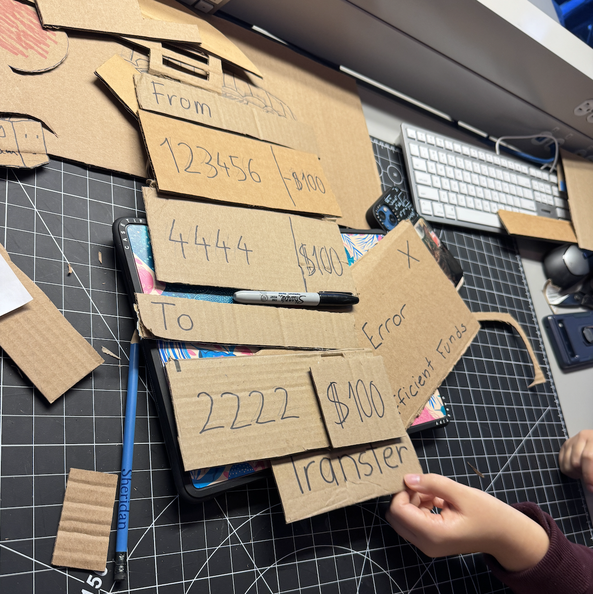 For our first iteration, we realized we had way too many cardboard pieces. This made it really hard to hold all of them when running through the prototype.